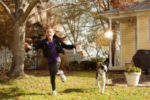 Girl running outside with TurfMutt