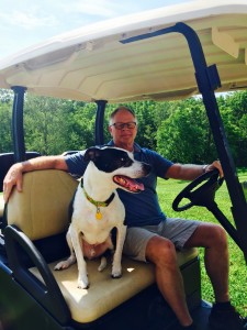 TurfMutt & Kris Kiser sitting in a golf cart