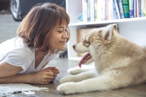 girl and dog on the floor