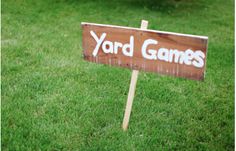 yard games sign in green lawn