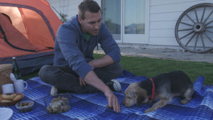 Dog trainer Brandon McMillan and Cosmo the rescue dog "practice" camping