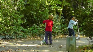 children playing outside in green space