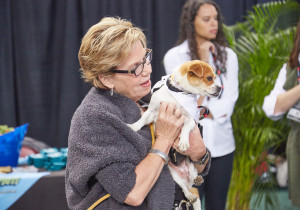 MUTT MADNESS puppy gives love to GIE+EXPO attendee